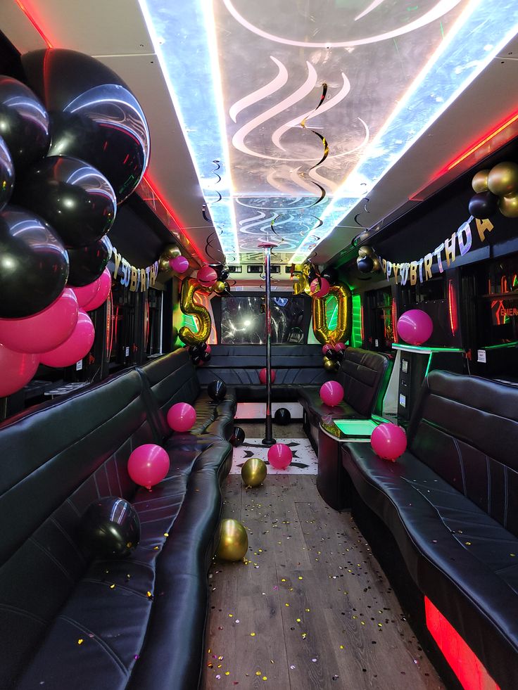 Luxury birthday party bus rental decorated for a 50th birthday celebration.