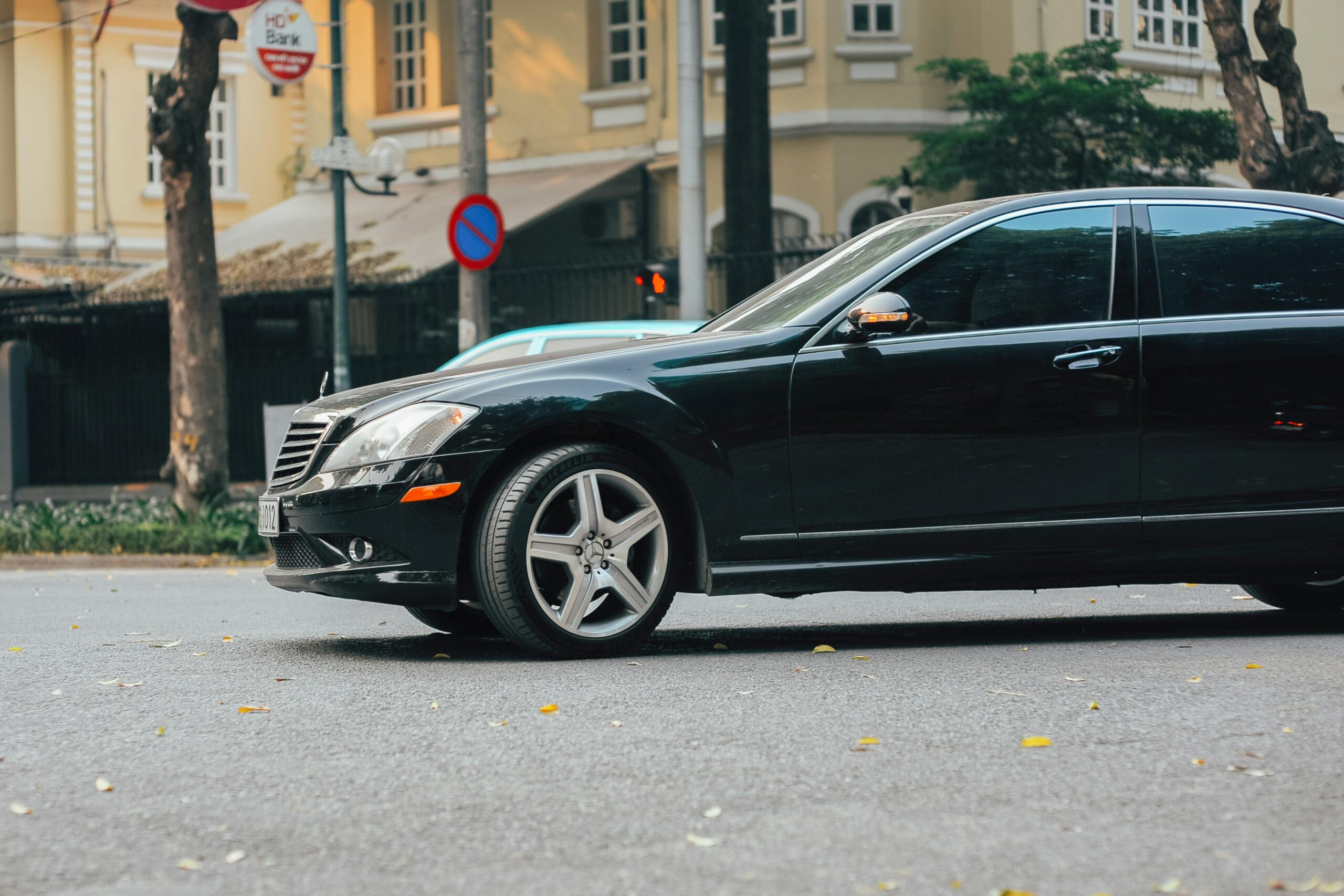 Black executive sedan providing elite premium car service for luxury rides and private travel.