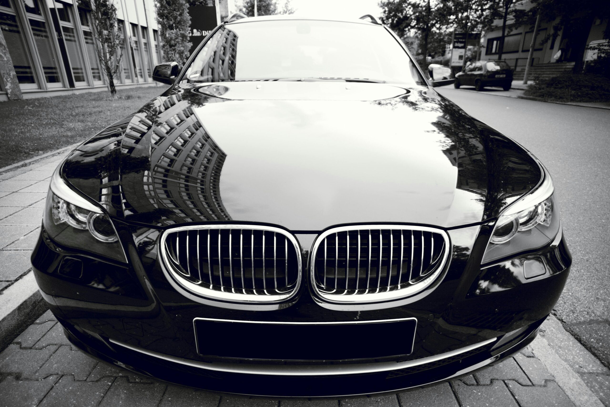 Black executive sedan providing elite premium car service for luxury rides and private travel.