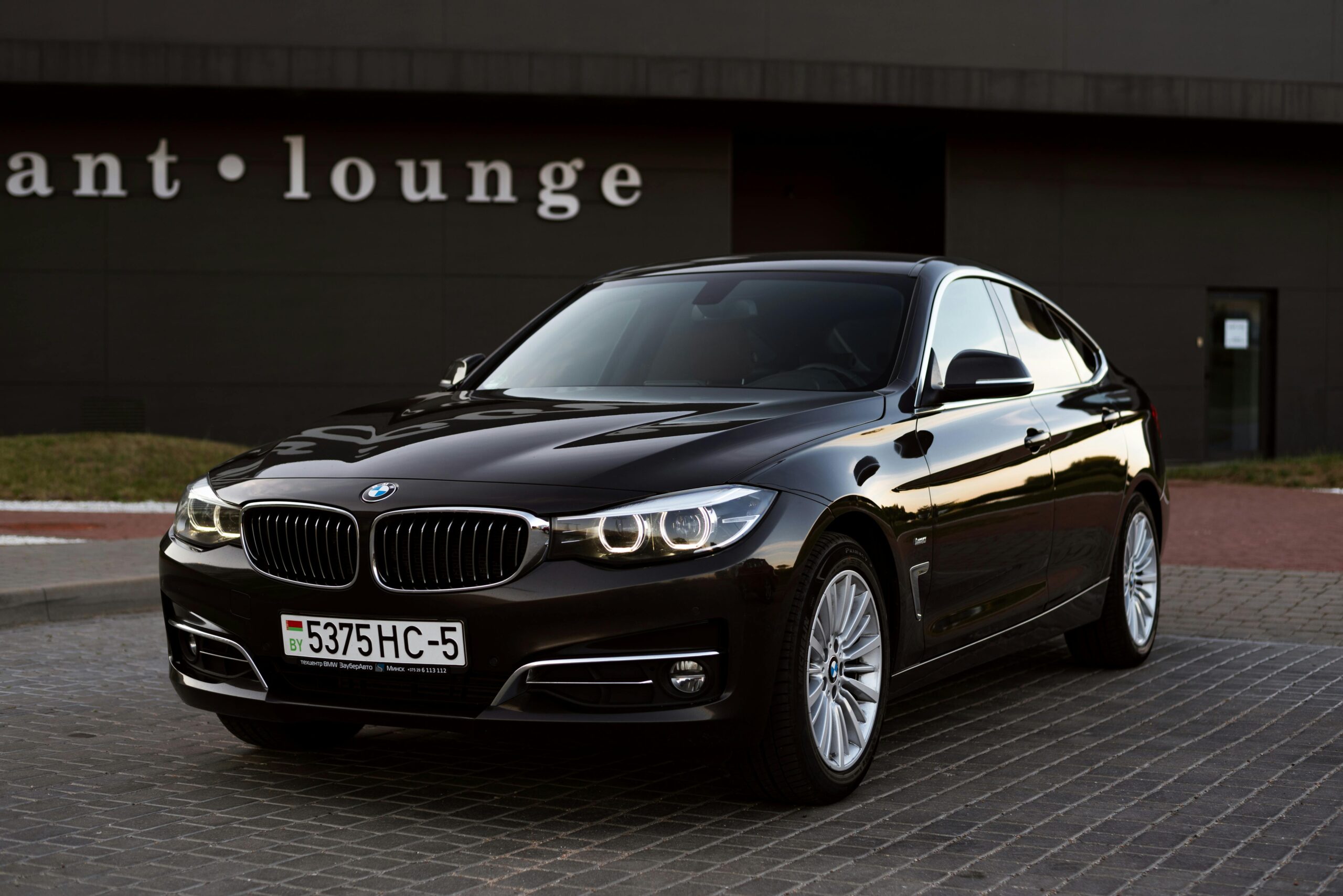 Executive black car service with a premium BMW for private chauffeur transportation.